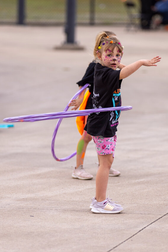 The Aledo Children's AdvoCats held their annual Glow Run on March 29 to raise funds for their charitable work in the community. See next week's issue for more coverage.