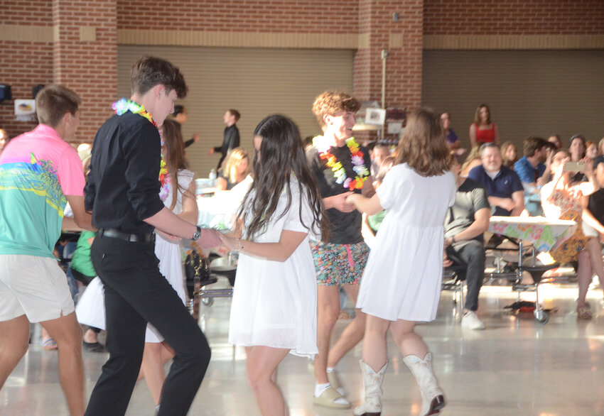 Students swing to the music.