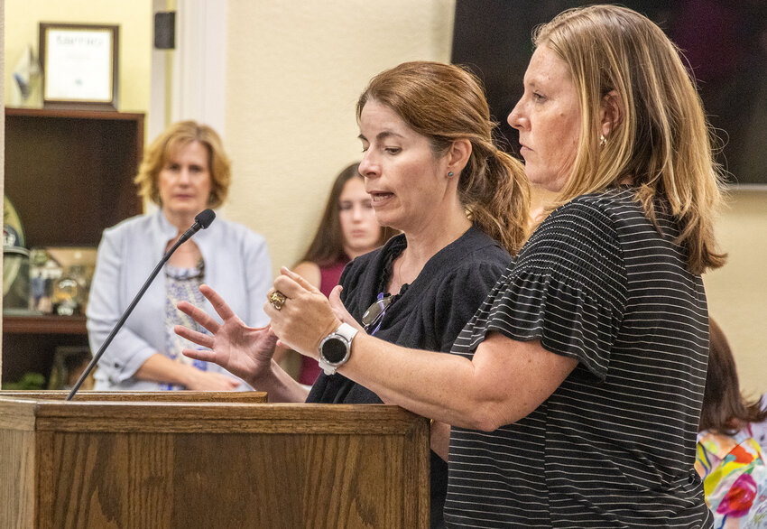 City engineer Gretchen Vazquez (left) and Parks Director Mandy McCarley (right) explain the alternate methods of transportation that would be improved through the applications to TxDOT.