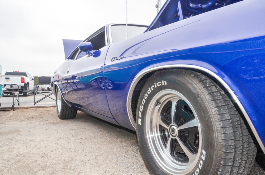 A low riding blue 1972 Dodge Challenger.