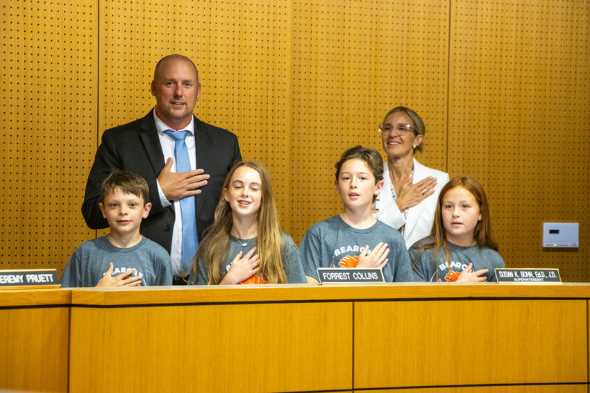 Annetta Elementary School students Jackson Brooks, Sadie House, Louis Bacigalupo and Delilah Martin lead the pledge during the May Aledo ISD board meeting.