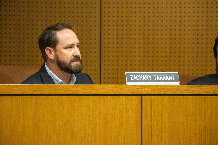 Aledo ISD board of trustees secretary Zach Tarrant compliments math coordinator Deanne Torres on her work.