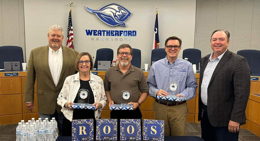 WISD board member Jeff Ford (left), Karen Allison, Charles Blackwell, Danny Golightly and WISD Superintendent Dr. Beau Rees at a reception on May 13 honoring Allison, Blackwell, Golightly and others (not pictured) who have retired from WISD this year.