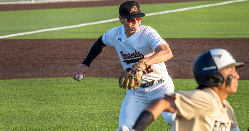 Third baseman, Ryan Jones fields a bunt and makes the throw over to first as a Rider baserunner scrambles down the line in Bearcat action in April of 2024.