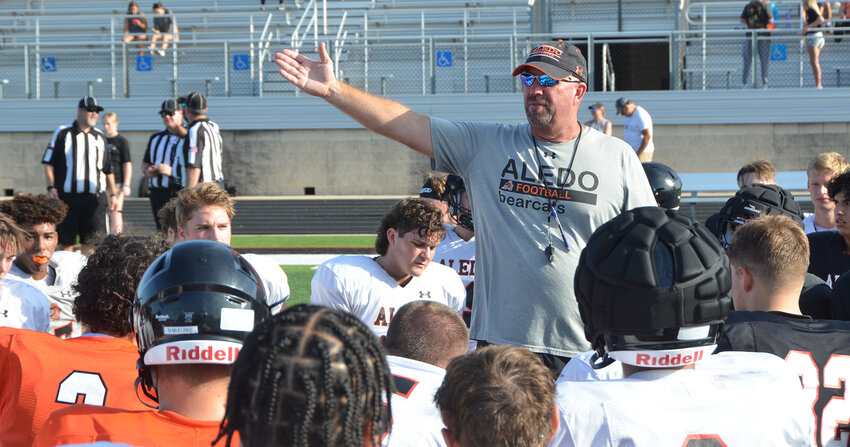 Aledo head football coach Robby Jones addresses players during an intrasquad scrimmage on Aug. 17.