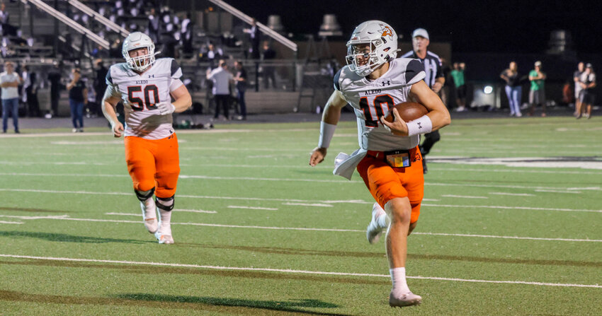 Gavin Beard finds an opening last season against Azle. Beard will captain the Bearcats this season. Also shown is Alex Arana (50).