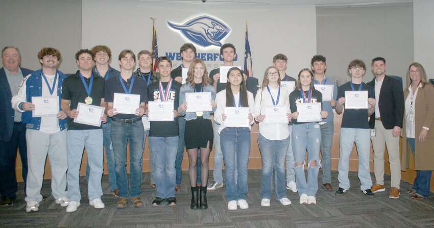 WHS DECA students are recognized for advancing to the state UIL competition.