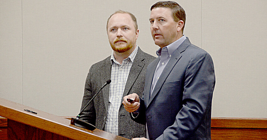 Josh Kercho of Kimley-Horn Engineering Consultants and city administrator Sterling Naron describe progress on a new wastewater plan with council members while pointing out locations on a projected map.