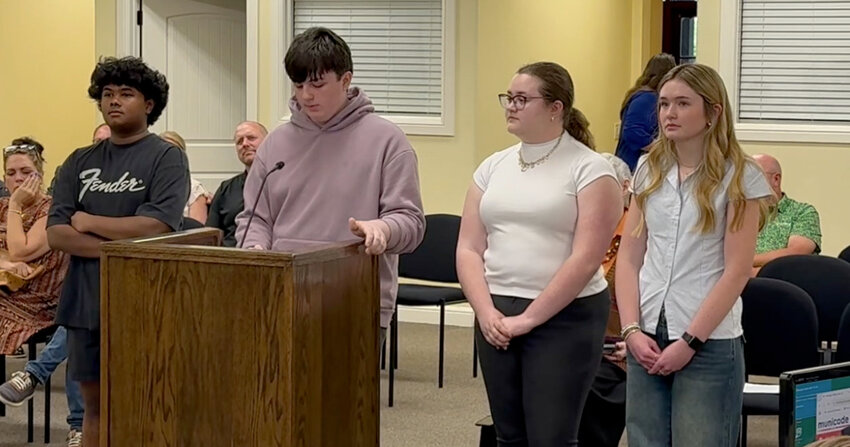 Aledo High School students (from left) Matthew Dominick, Samuel Ghent, Amelia Buck, and Faith Bartlett presented their design for a restroom/picnic pavilion for King’s Gate Park at the April 22 city council meeting.