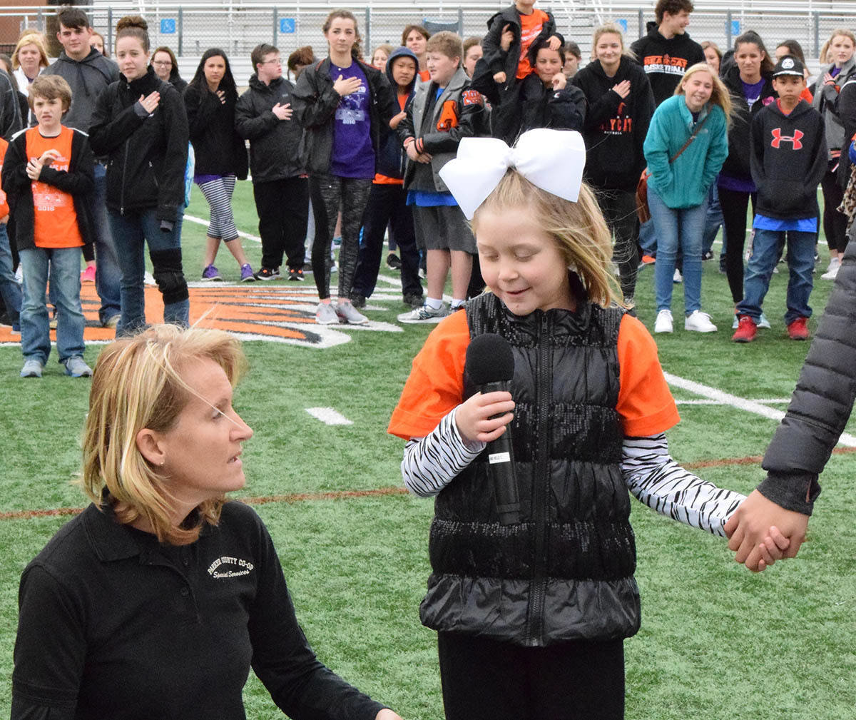 Molly Finessed, a student at Stuard Elementary School, sang the National Anthem at the beginning of Aledo ISD's Jumping' Jamboree on April 1 at Bearcat Stadium. More photos will be in the April 8 issue of The Community News.