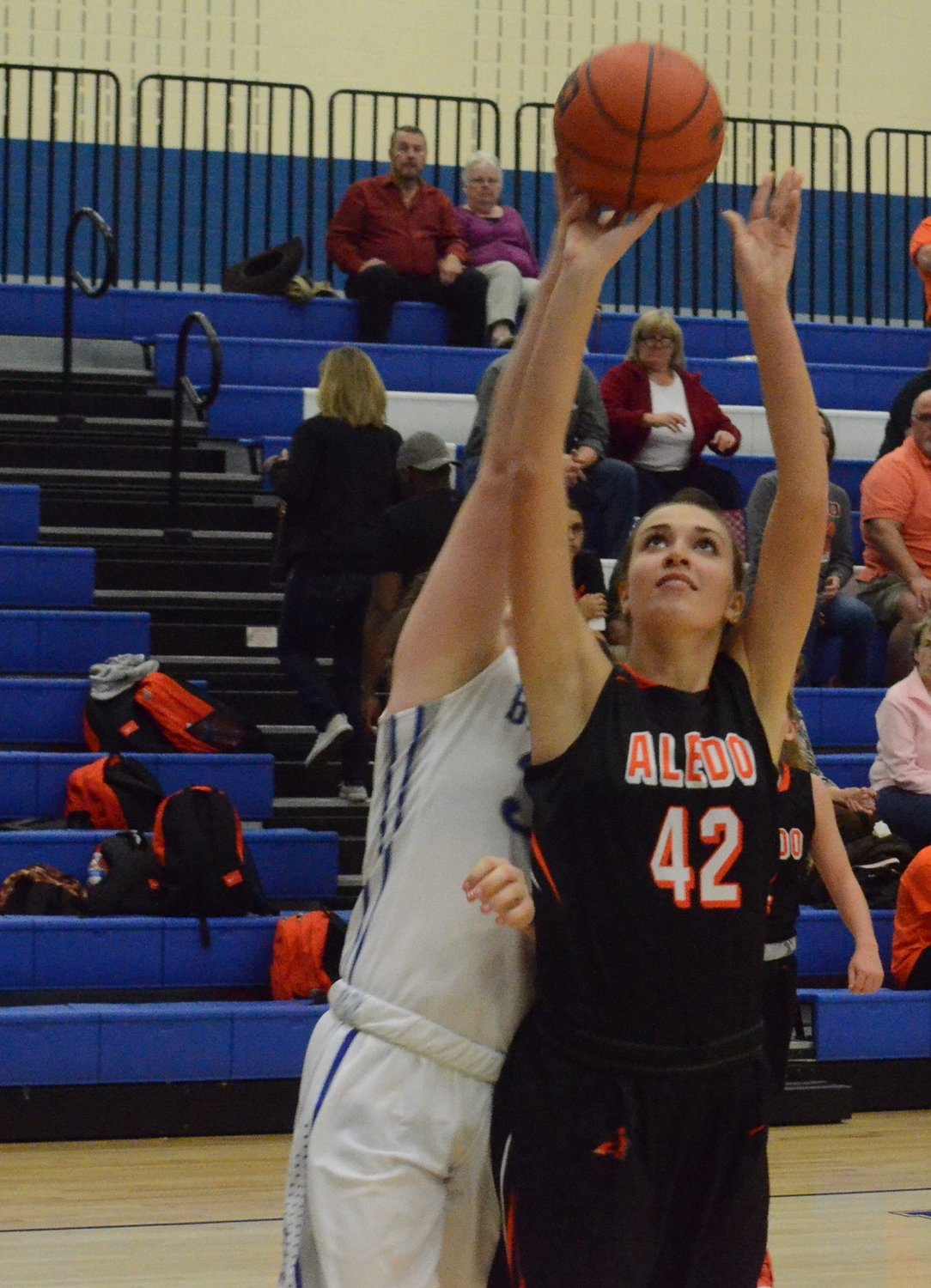Aledo post Abby Losos (42) goes up strong to the hoop Tuesday night during the Ladycats' win at Brewer.