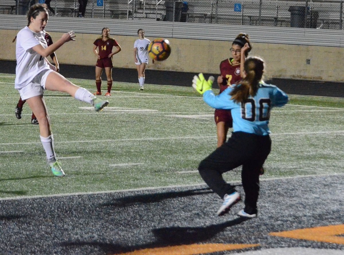 Aledo sophomore forward Hunter Jones elevates a shot from close range Tuesday night during the Ladycats' 6-0 victory over Saginaw at Bearcat Stadium in a girls' District 6-5A soccer match. Photo by Tony Eierdam