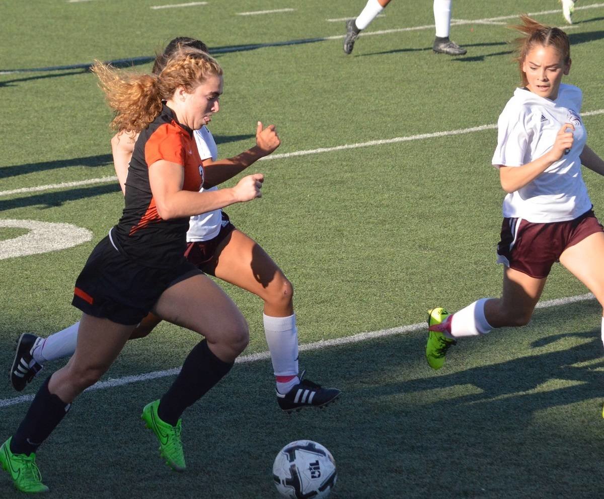 Aledo senior midfielder Cameron Huddleston races down field Friday during the first half of the Ladycats’ victory over El Paso Andress in a regional semifinal soccer match in Wichita Falls. Huddleston scored two goals to pace the Ladycats. Photos by Tony Eierdam