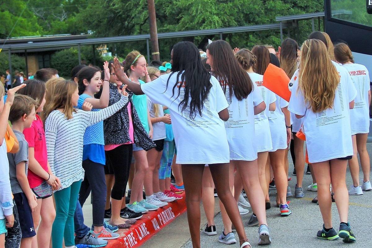 Trading high fives with their young fans, the Aledo Ladycats soccer team had a send off today at Vandagriff Elementary School. The send off began at the high school. Photo by Bailey Tovar