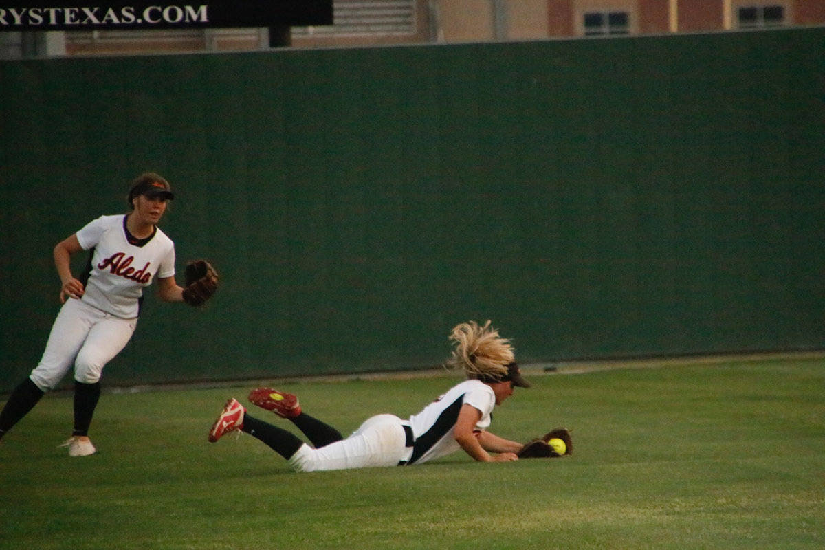 Lindsey McElroy looks on as Gracie King makes a diving catch in the seventh inning. 
Photo by David Andrews