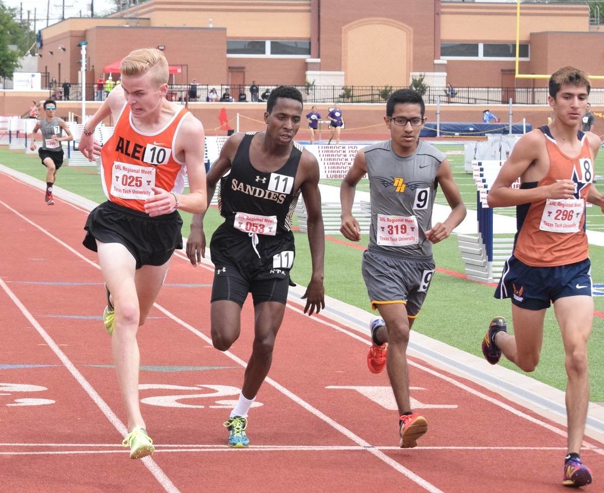 Aledo long-distance runner Graydon Morris stretches over the finish line to win the boys' 3,200-meter run Friday at the regional meet in Lubbock. He will advance to the state meet in Austin. Photos by Tony Eierdam