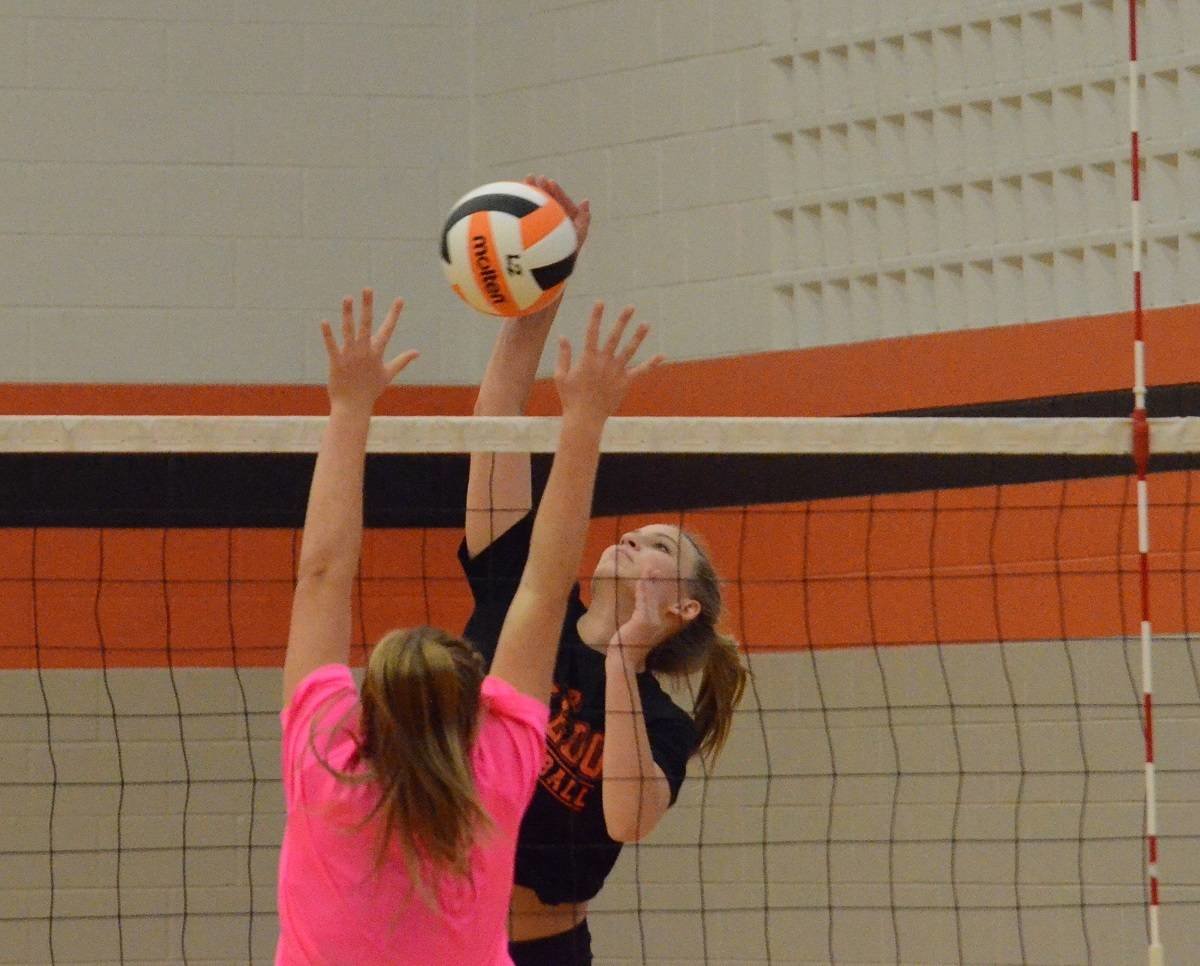 Four-year varsity hitter Sydney Casey slams down a kill during the Ladycats/Peaster scrimmage Saturday at the Daniel Ninth Grade Campus gym. The Ladycats open the regular season at 6 p.m. Monday at Waco Midway. Photos by Tony Eierdam