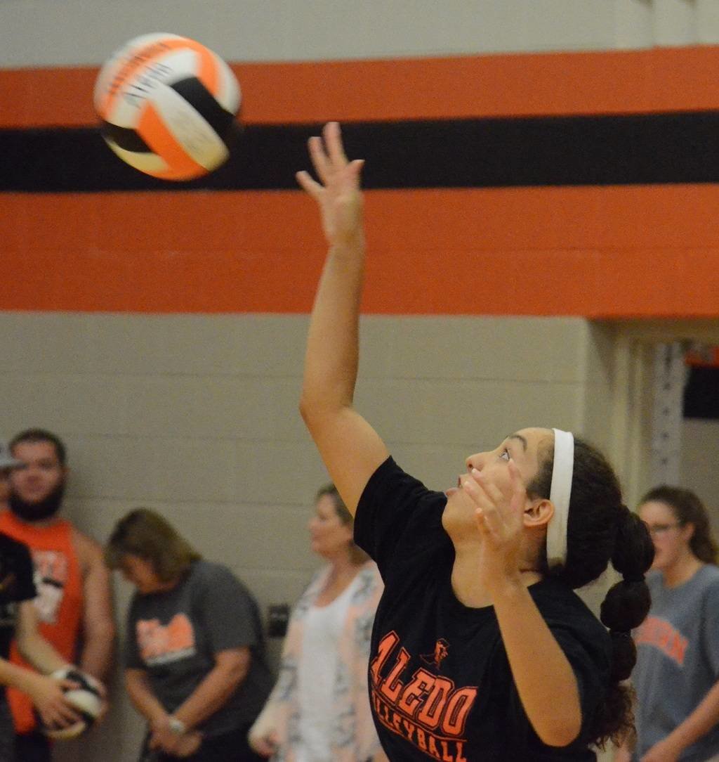 Aledo outside hitter Evelyn Torres sends down a kill Saturday during the Ladycats home scrimmage against Peaster at the Daniel Ninth Grade Campus gym. The Ladycats open the regular season at 6 p.m. today at Waco Midway. Photo by Tony Eierdam