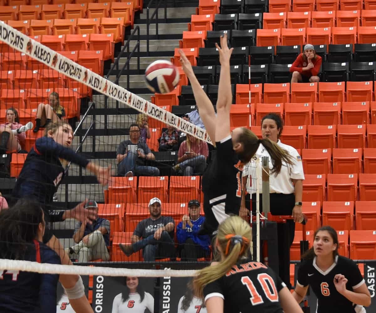 Aledo sophomore middle Daleigh Ellison scores a point off a block during the Ladycats' sweep of Northwest in a District 6-5A match at Aledo. Photo by Tony Eierdam