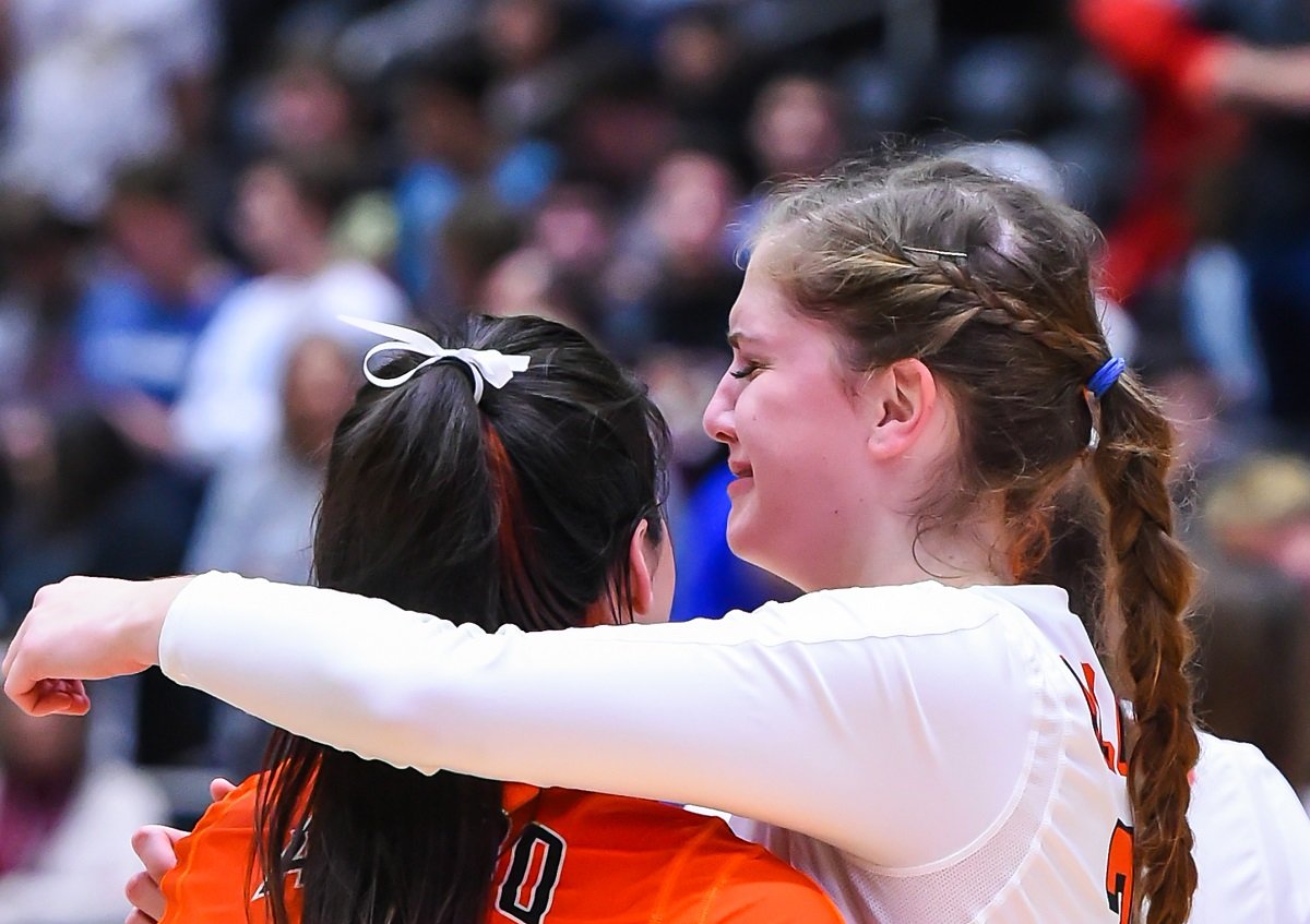 Aledo seniors Allegra Rivas, left, and Sarah Haeussler console each other moments after the Ladycats fell to Leander Rouse in a Class 5A state semifinal match this afternoon in Garland. Photos by Howard Hurd
