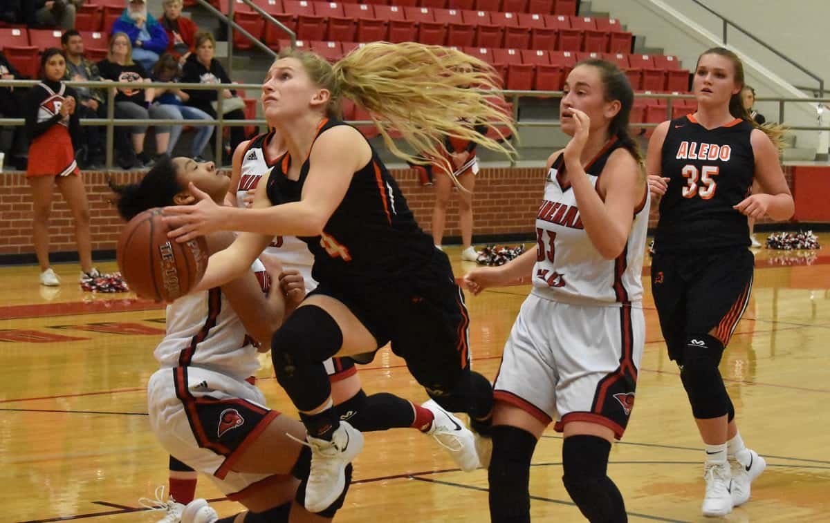Aledo guard Riley Sale sails through the air toward the basket Tuesday night during the Ladycats' 41-34 win at Mineral Wells. Photos by Tony Eierdam