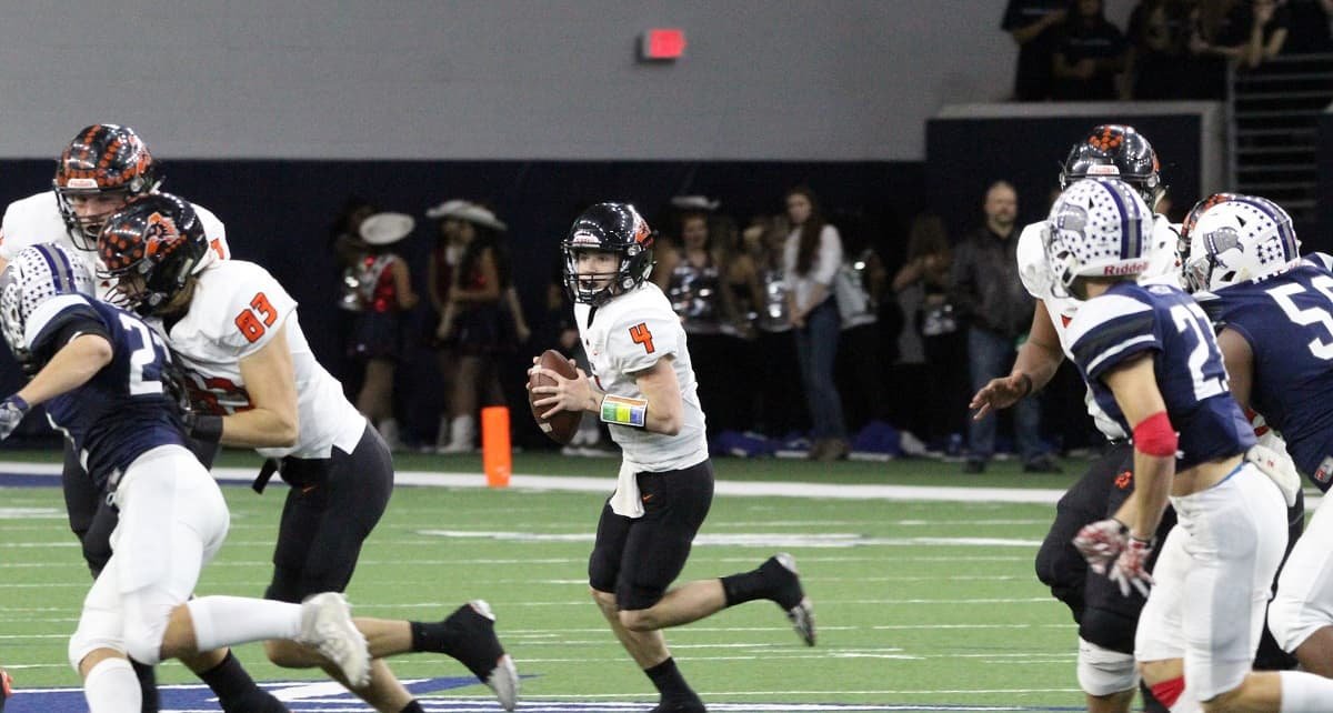 Under excellent pass protection, Aledo quarterback Jake Bishop (4) looks down field during the Bearcats' 43-7 victory over Richland in a 5A Division II state quarterfinal game Saturday at The Star in Frisco. Photos by Karen Towery