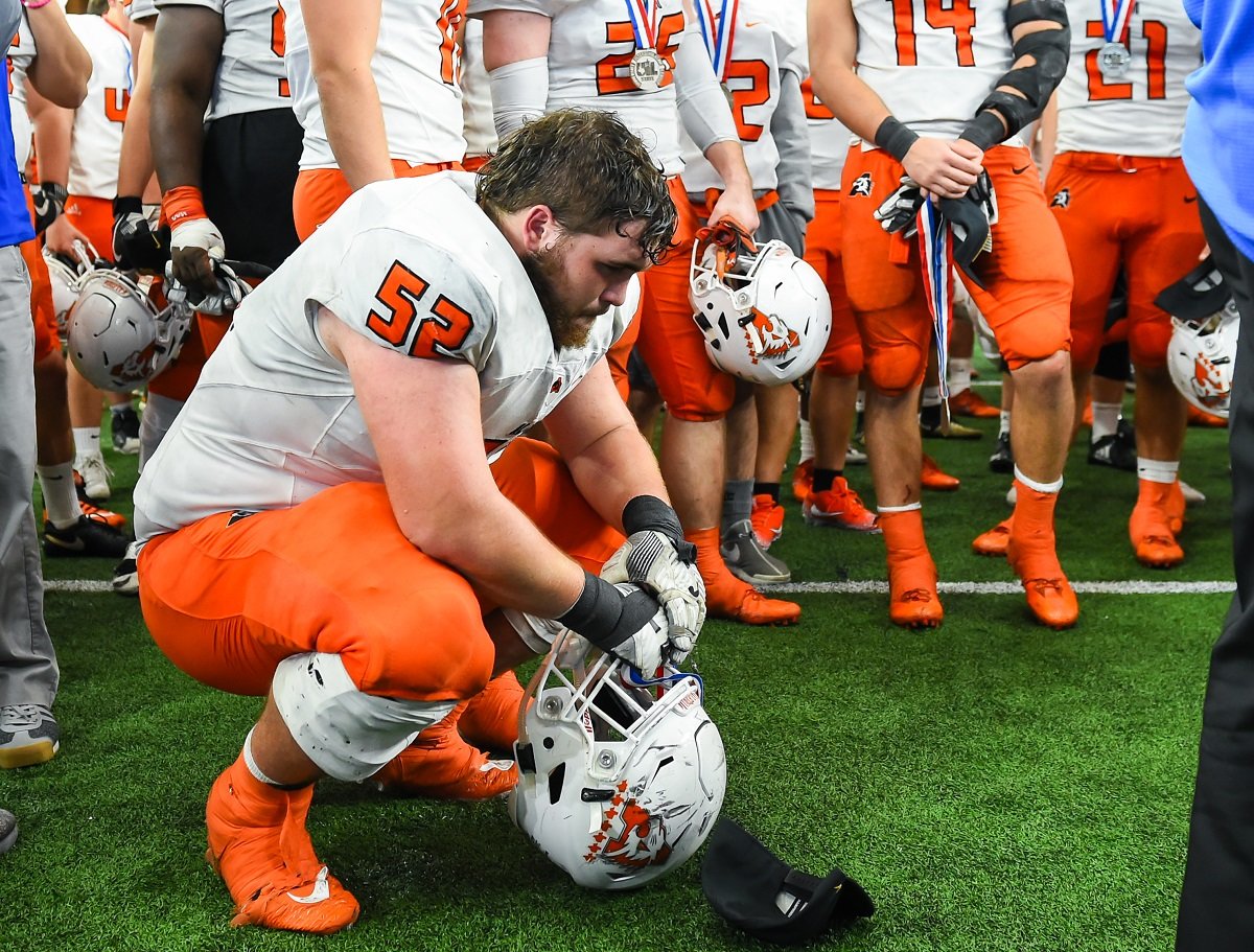 Aledo senior captain Truett Knox displays his emotions shortly after the Bearcats fell to College Station, 20-19, Saturday in the Class 5A, Division II state championship game at AT&amp;T Stadium in Arlington. Photos by Howard Hurd