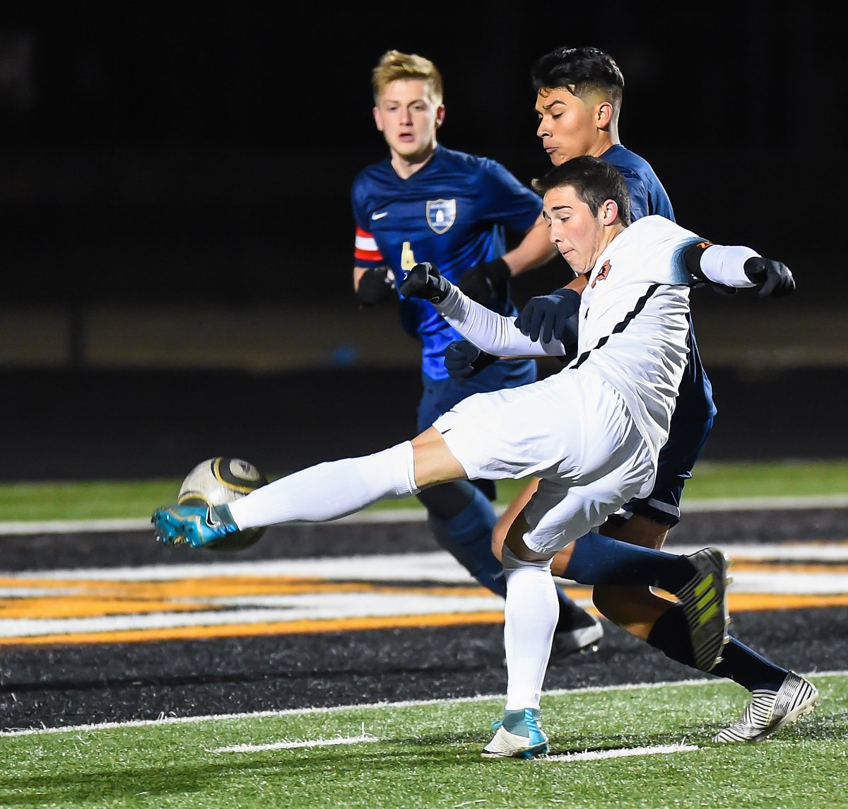 Aledo junior midfielder Brandon Wrinkle takes a shot that would find the back of the net for a goal Saturday night during the Bearcats' shootout loss to Arlington Heights. Wrinkle also scored in the shootout. Photo by Howard Hurd