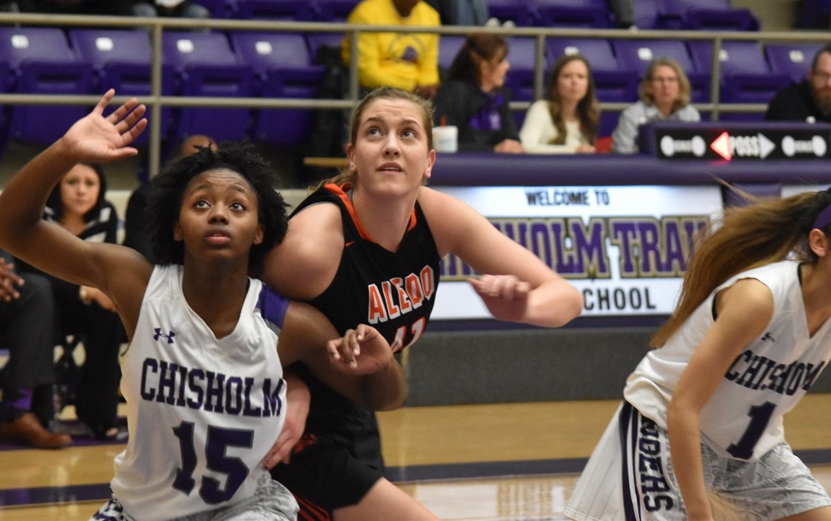 Aledo senior post Sarah Haeussler (41) fights under the basket Tuesday night during the Ladycats' win at Chisholm Trail. Haeussler scored 16 points and grabbed 10 rebounds. Photos by Tony Eierdam