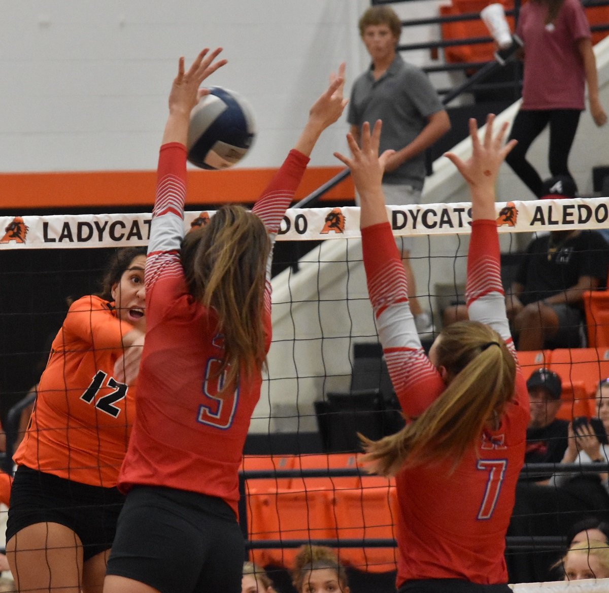 Aledo hitter Evelyn Torres slams a spike for a kill during the Ladycats' 3-1 victory over Midlothian Heritage Friday at the Aledo High School gym. Photo by Tony Eierdam