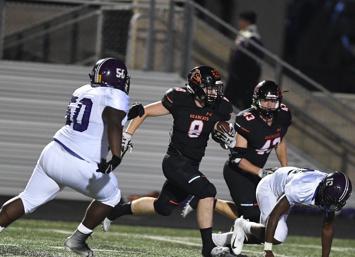 Aledo linebacker Max Lucas (8) races to the end zone after an interception in the second quarter during the Bearcats’ 52-6 victory over Everman Friday night at Bearcat Stadium. Lucas returned the ball 24 yards for the score.