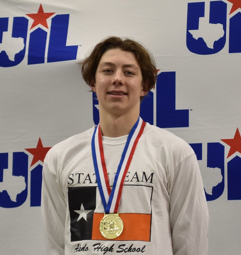 Aledo junior Elijah Sohn receives a gold medal after winning the boys’ 200 freestyle race this afternoon in the finals of the Class 5A Swimming and Diving State Championships at the University of Texas. Photo by Tony Eierdam