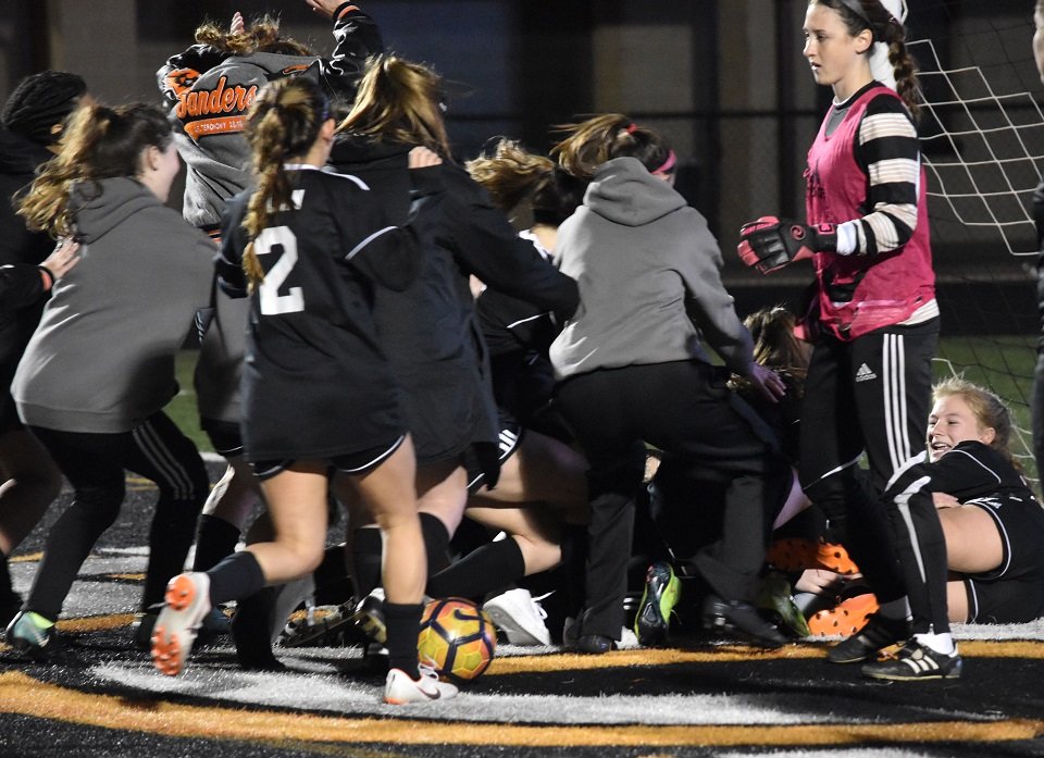 Aledo  mobs goalkeeper Emma Davis after she blocked three of five shots in the shootout to give the Ladycats a shootout victory over Wichita Falls Rider Wednesday night at Bearcat Stadium. Photo by Tony Eierdam