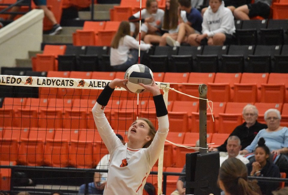 Aledo sophomore setter Mattie Gantt sets up a hitter during the Ladycats' sweep over Arlington Seguin Tuesday night at Aledo. Gantt finished with a match-high 20 assists. Photo by Tony Eierdam