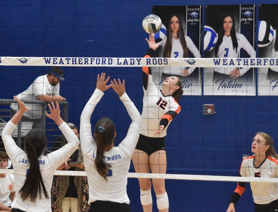 Aledo senior hitter Daleigh Ellison (12) sends down one of her 23 match-high kills Tuesday night during the Ladycats' 3-2 win at Weatherford. Photo by Tony Eierdam