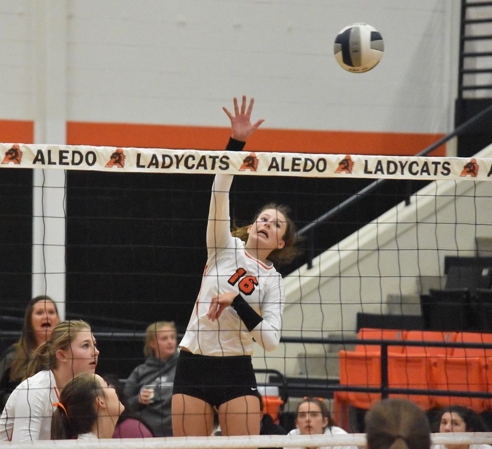 Aledo junior hitter Lilly Taylor (16) sends down a kill during the Ladycats sweep of Midlothian Tuesday night at the AHS gym. Photo by Tony Eierdam