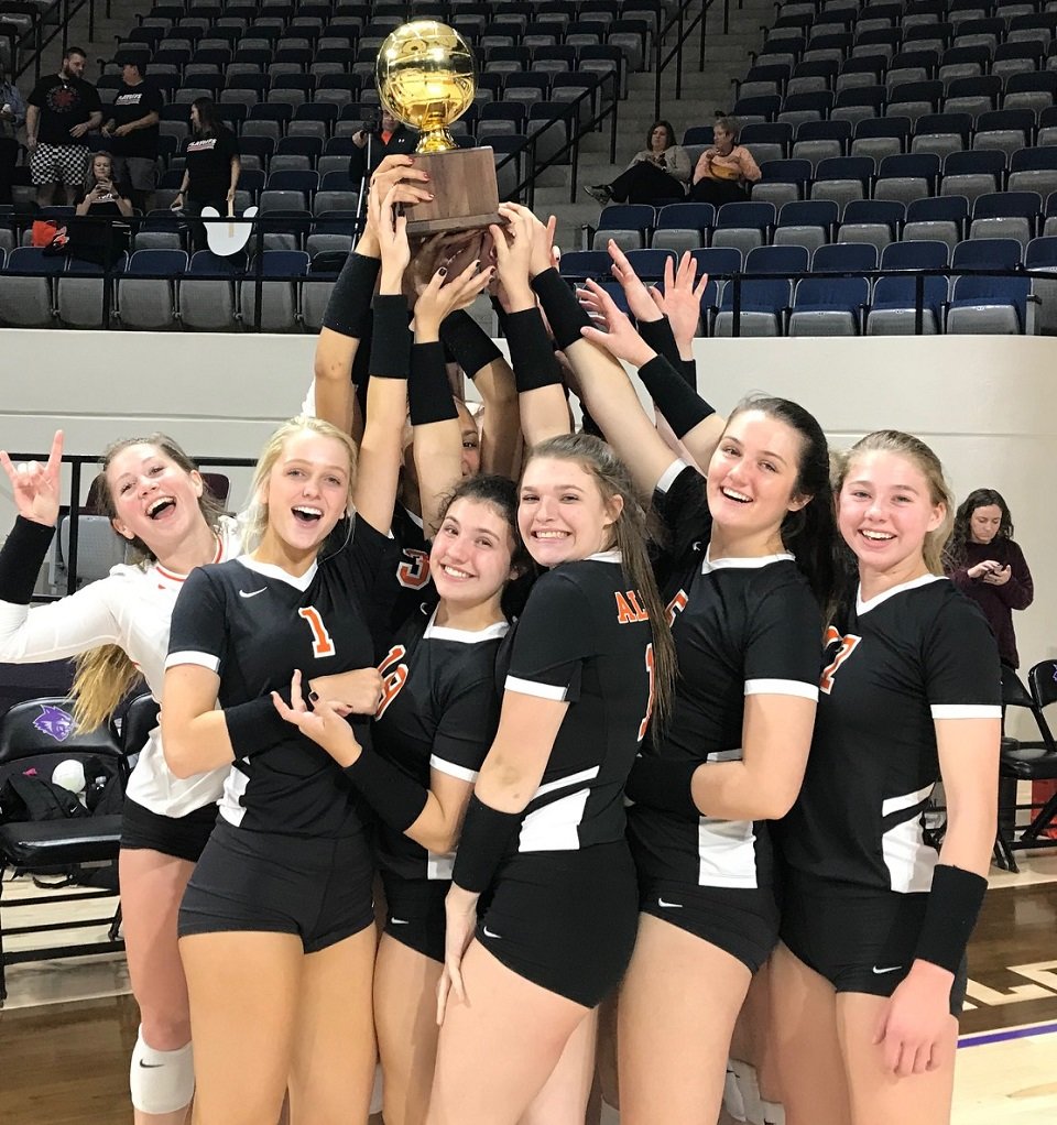 The Aledo Ladycats celebrate after sweeping Lubbock Cooper in a bi-district playoff match Monday night at Abilene Christian University. Photo by Tony Eierdam