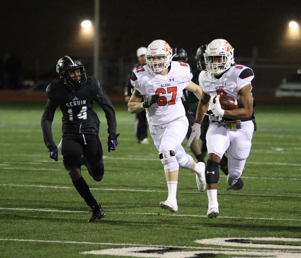 Aledo senior tailback Jase McClellan (9) scores the first of four first-half touchdowns during the Bearcats’ 56-13 win over Arlington Seguin Friday night in Arlington in the District 5-5A finale. Also shown is offensive lineman Aidan Hays (67). Photo by Cynthia Llewellyn