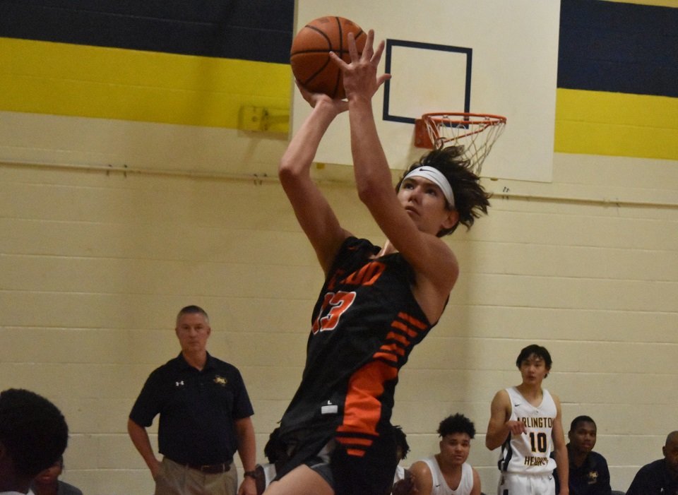 Aledo guard Daniel Sohn (13) drives in for a layup during the Bearcats' loss to Arlington Heights Tuesday night at Arlington Heights High School. Sohn led the Bearcats with 17 points. Photo by Tony Eierdam