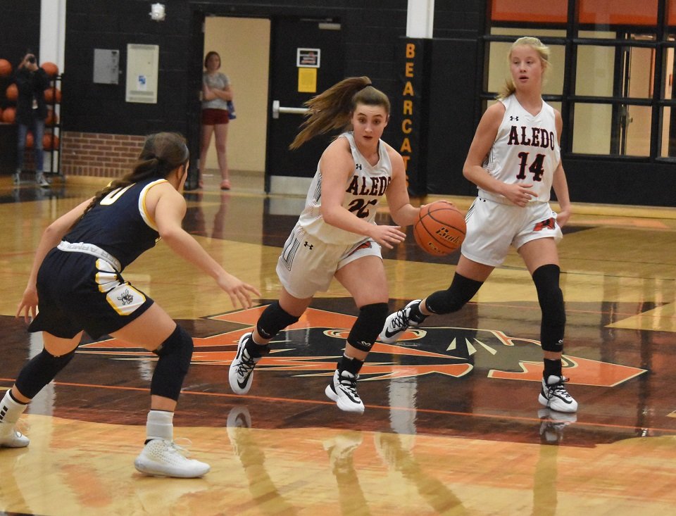 Aledo senior guard Haley Herrin (22) sets up the offense as Abby Morrison (14) gets into position during the Ladycats loss to Stephenville Tuesday night at Aledo. Photo by Tony Eierdam