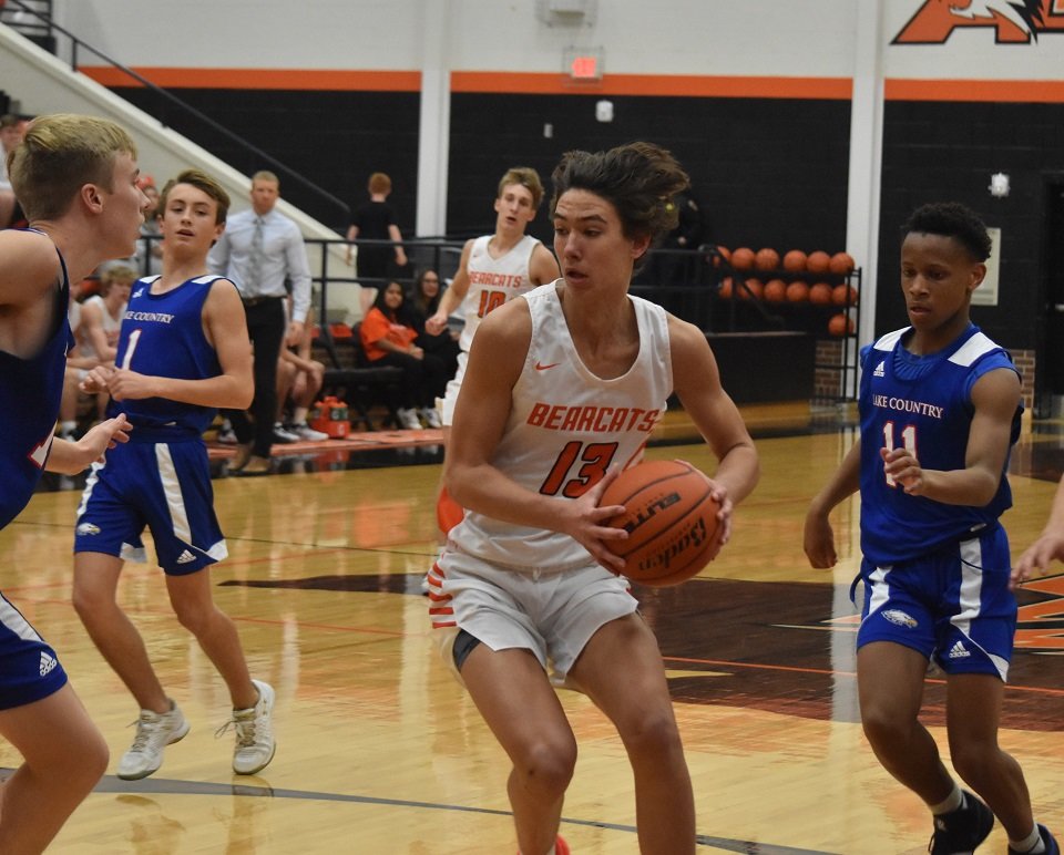 Aledo sophomore guard Daniel Sohn (13) drives the lane during the Bearcats' 64-45 victory over Fort Worth Lake Country. Sohn led all scorers with 21 points. Photo by Tony Eierdam