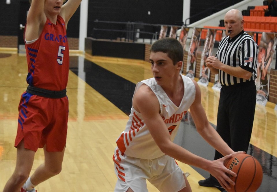 Aledo senior guard Reid Dietrich looks to pass during the Bearcats' loss at home to Grapevine. Dietrich led the Bearcats with 20 points, including six three-pointers. Photo by Tony Eierdam