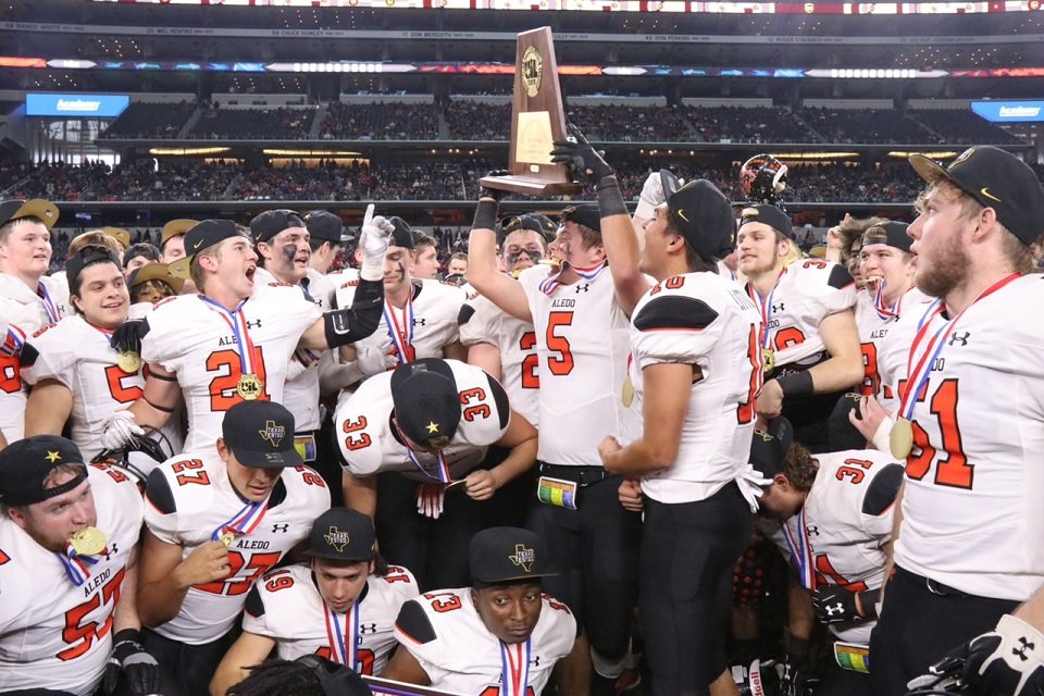 The Aledo Bearcats celebrate their state-championship victory over FB Marshall. Aledo won 45-42 to capture the school's ninth state football championship. Photo by Cynthia Llewellyn