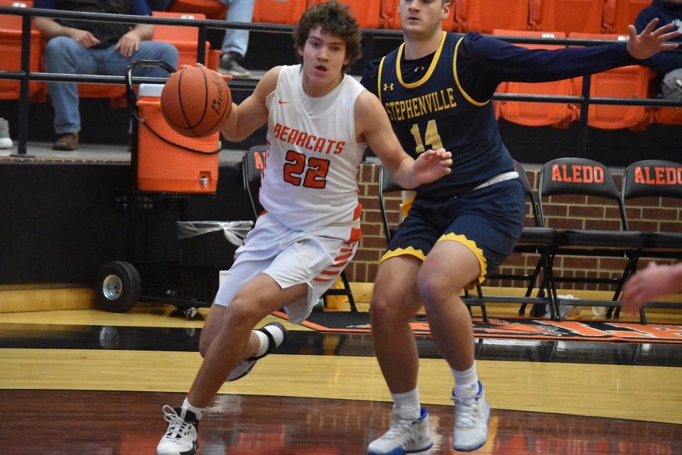 Aledo guard Christian Hillman (22) dribbles past a defender during the Bearcats' 51-41 victory over Stephenville Monday afternoon at Aledo. Photo by Tony Eierdam