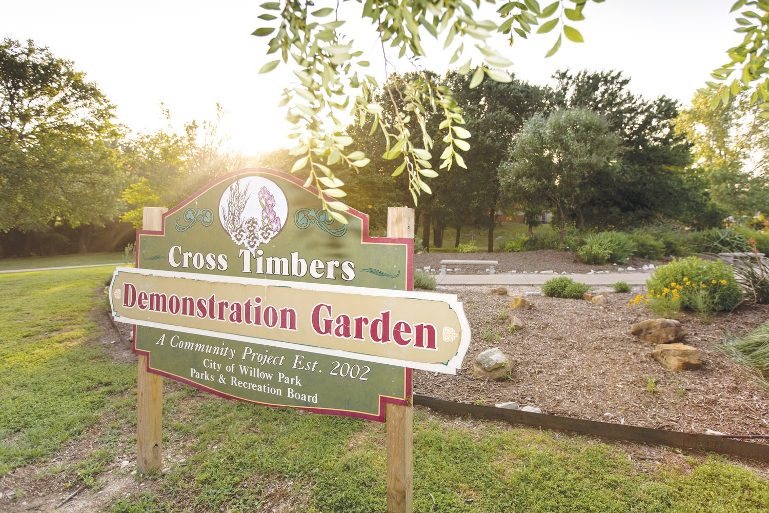 The Cross Timbers Demonstration Garden consists of berms, walkways, benches, vines, trees and other plants. Started as a community project in 2002, the Parker County Master Gardeners now maintain the garden.
