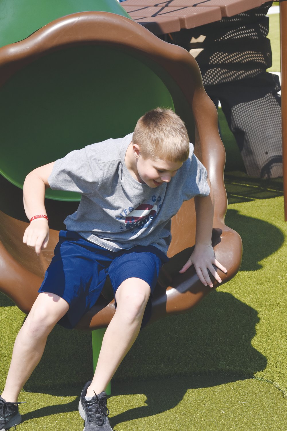 Gage Andress scampered out of one of the covered slides at the grand opening of Cross Timbers Park in April 2021.