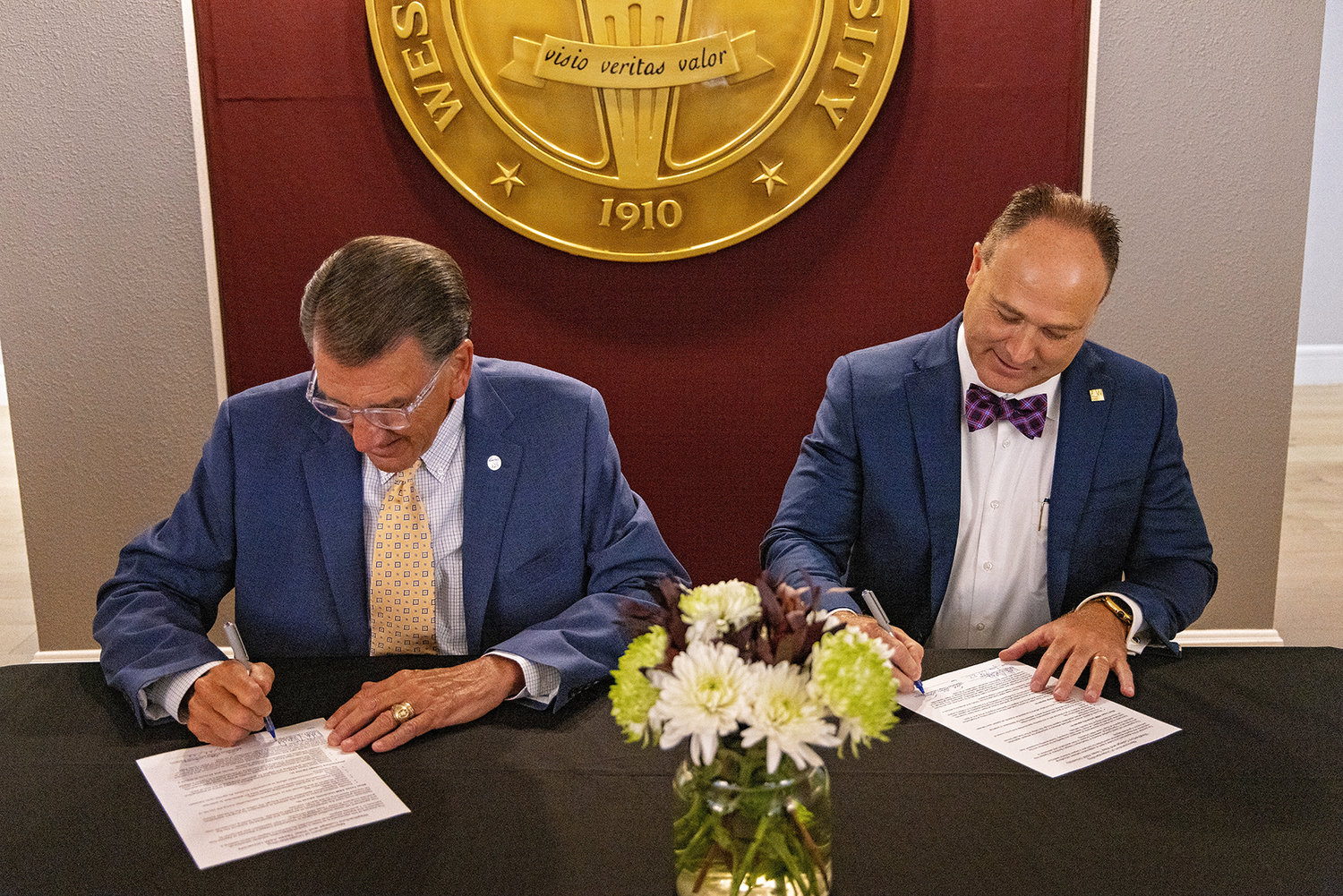 West Texas A&M University President Walter V. Wendler (left) and Weatherford College President Tod Allen Farmer signed a memorandum of understanding on June 28 for a graduate school transfer agreement between the two schools.