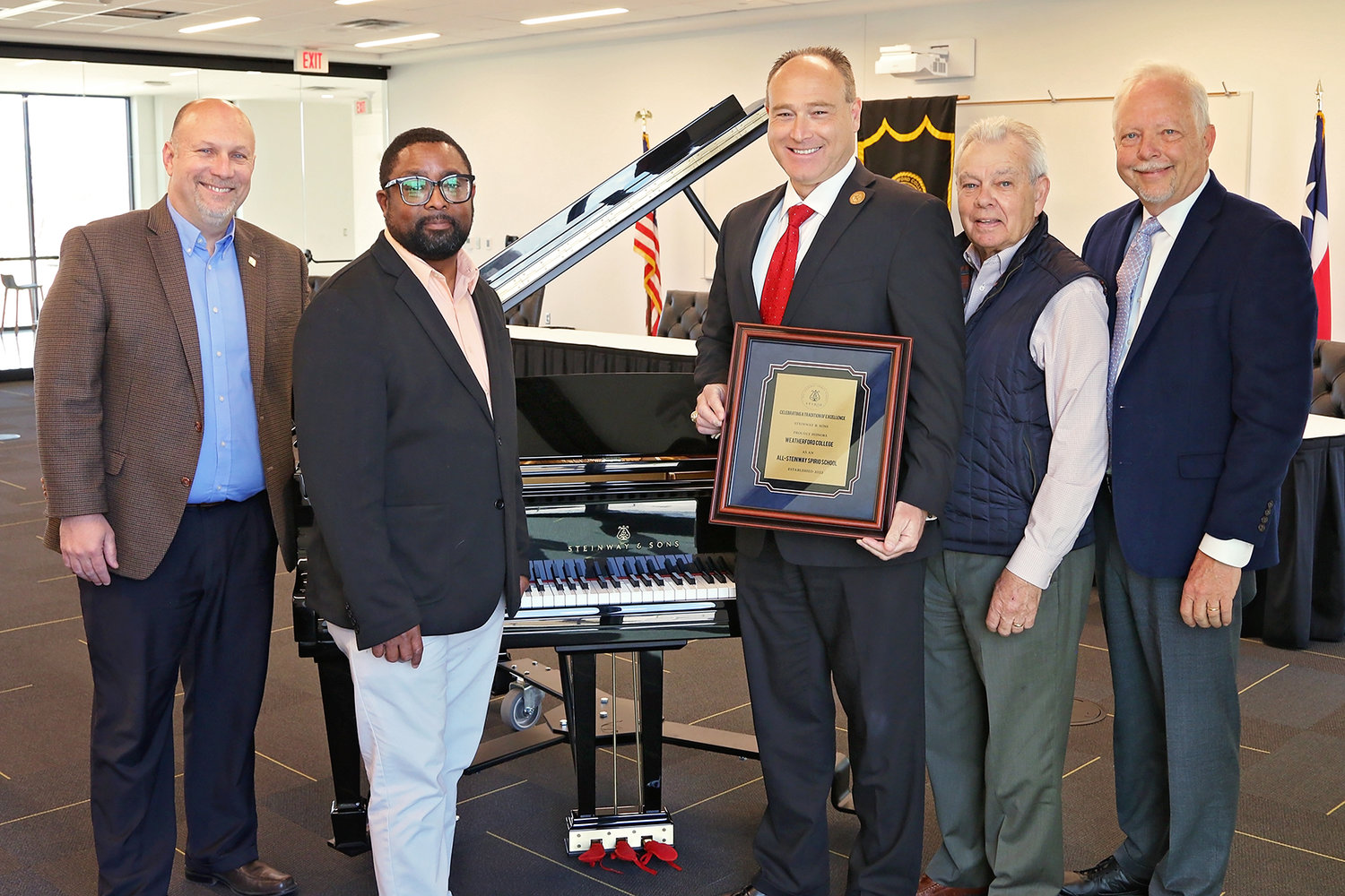 From left: Brent Baker, Vice President of Institutional Advancement; Frederick Sanders, director of the WC Jazz Orchestra; Dr. Tod Allen Farmer, WC President; Duane Durrett, WC's dean of fine arts; and Bryan Elmore, director of institutional sales and services with Steinway & Sons