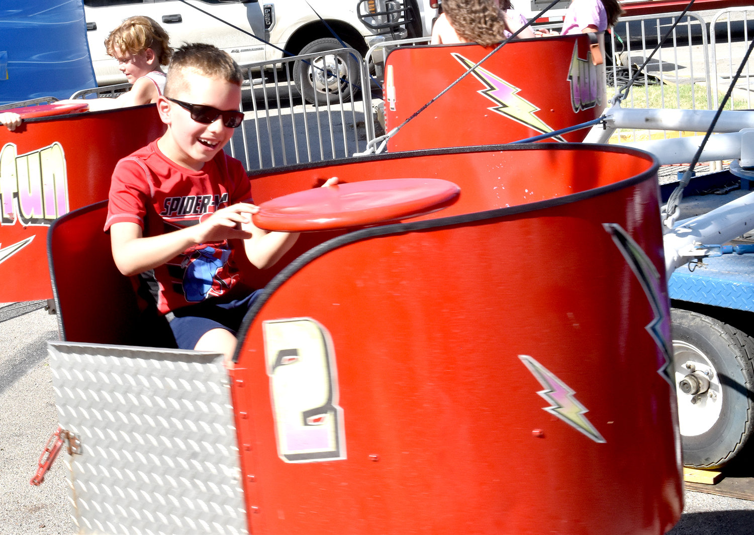 Gavin McKinley smiled through the "Tubs of Fun" carnival ride.