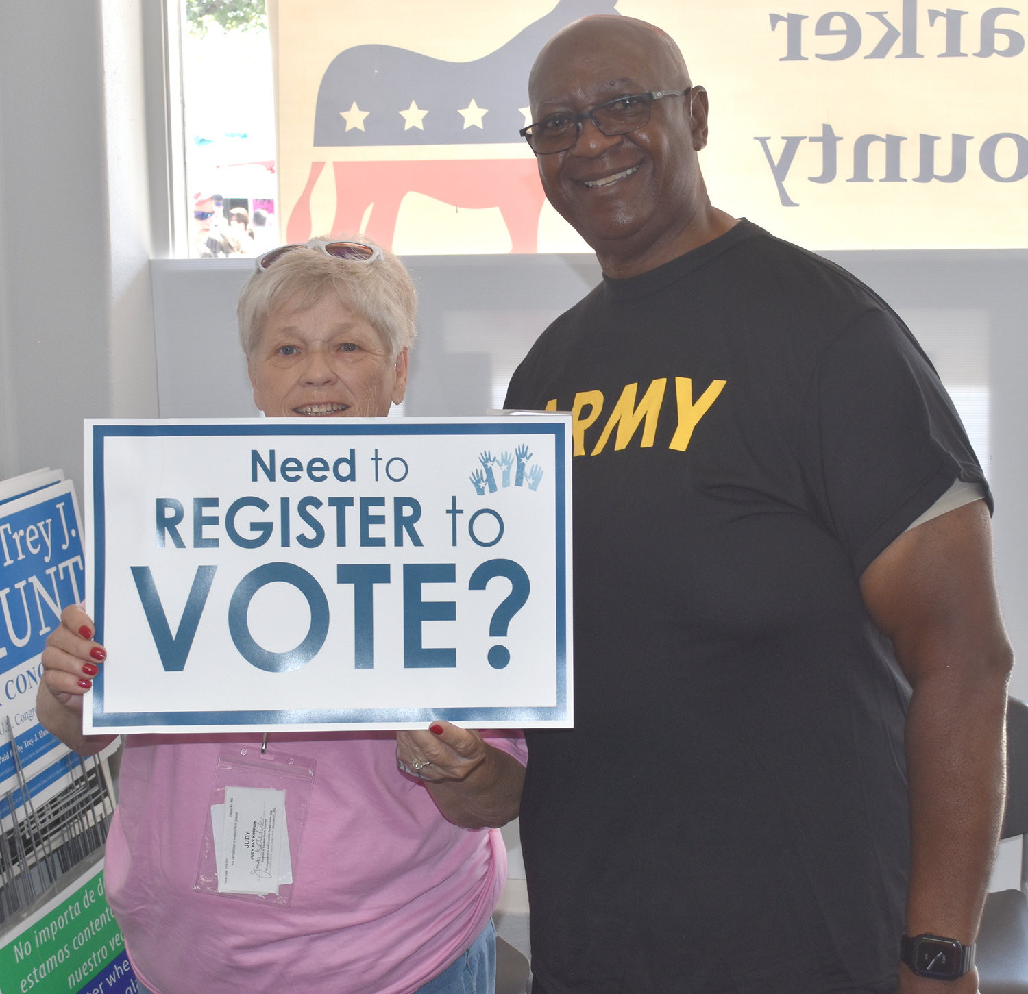 Judy Kotrlik and EWddie Burnett registered voters at Democratic Party headquarters on the square.